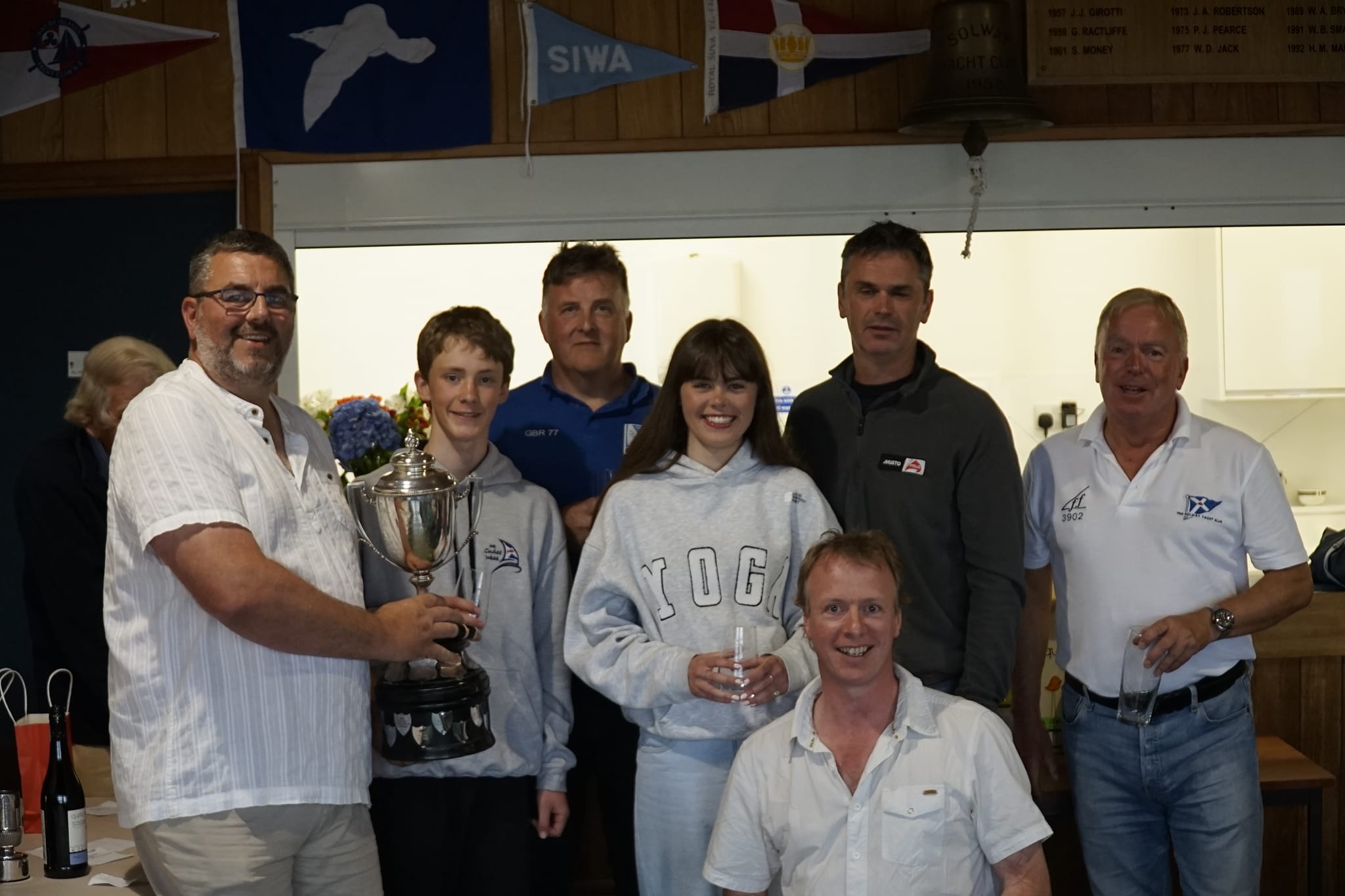 Club Commodore Scott McColm presents the “Prince of Wales” Trophy to the four winning helms and crews, winning not only each of their fleets but every race in the series in their fleets. (Photo: Finlay Train) 